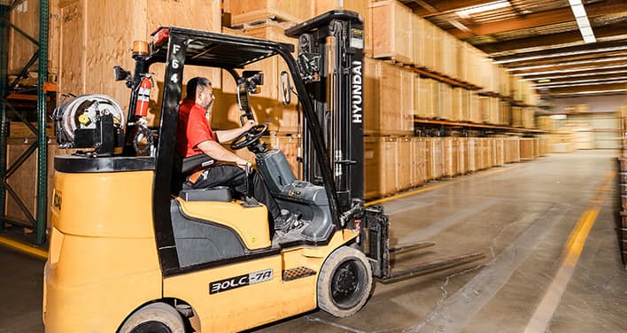 forklift moving in warehouse