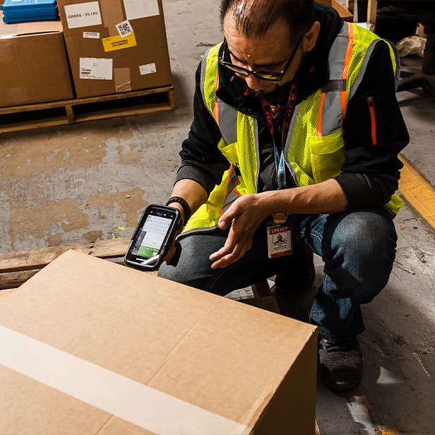 team member scanning a box ready for delivery