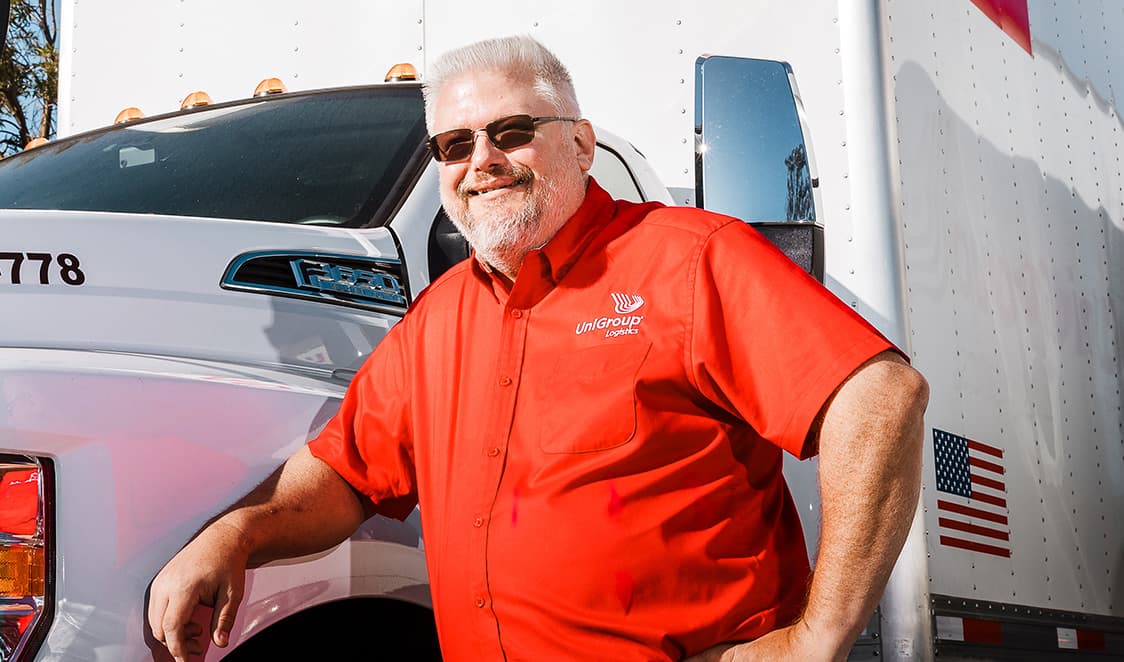 man posing with truck