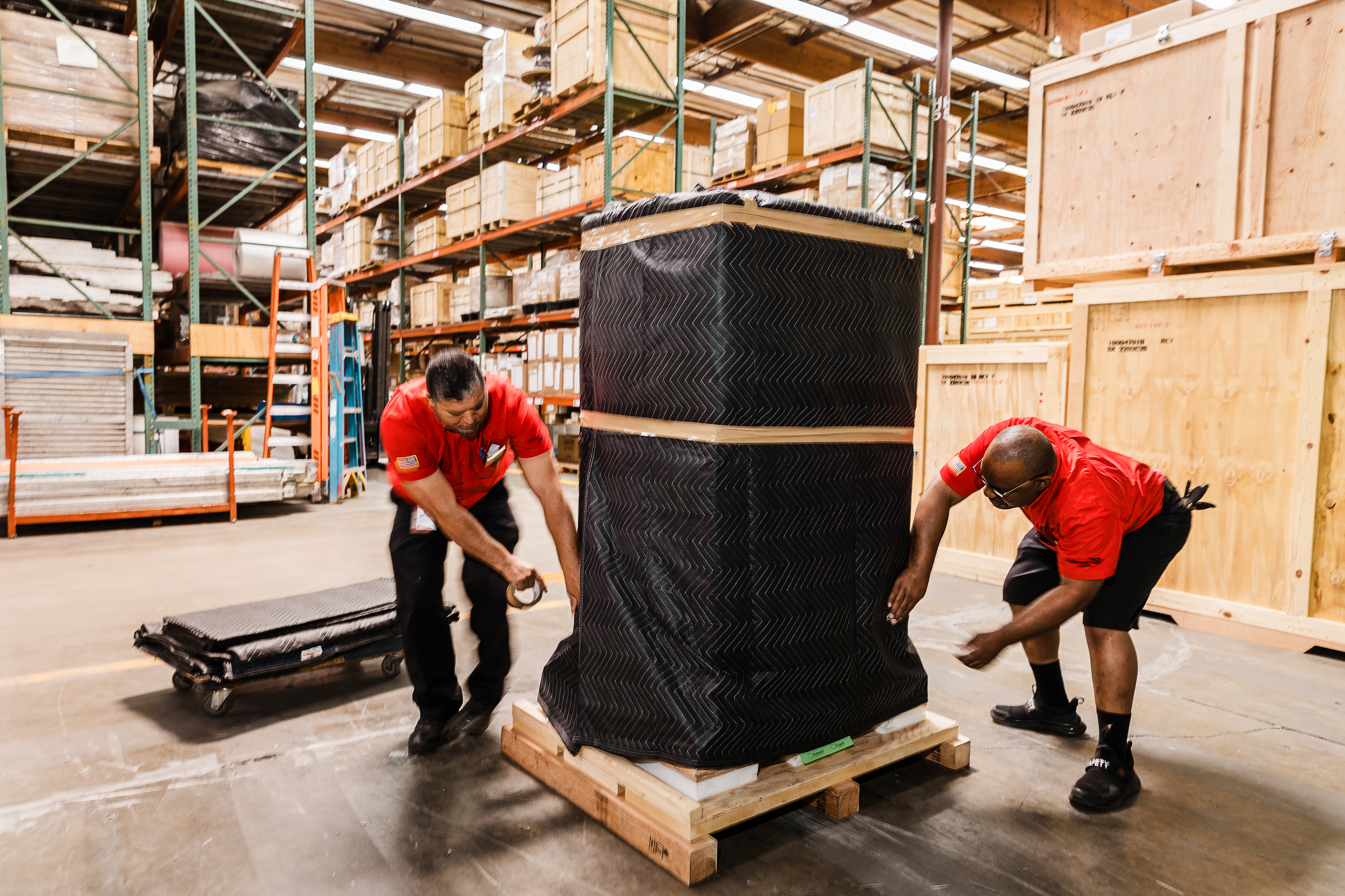 Legacy team packaging up an item in warehouse